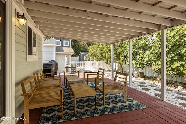 wooden terrace with a grill