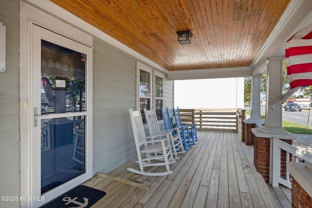 wooden terrace featuring a porch