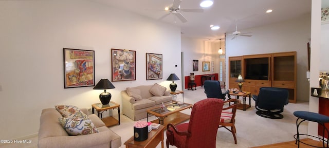 carpeted living room featuring ceiling fan