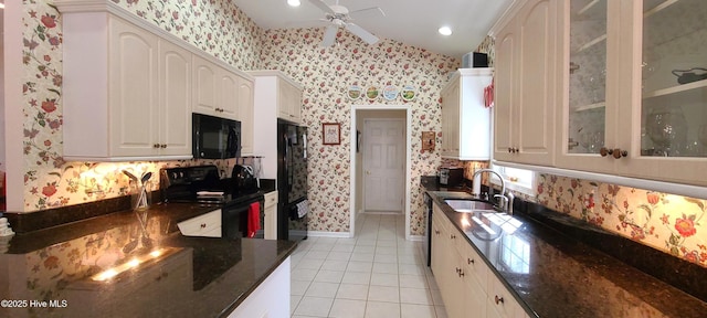 kitchen with white cabinetry, sink, light tile patterned floors, ceiling fan, and black appliances