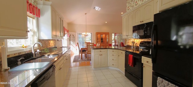 kitchen featuring vaulted ceiling, hanging light fixtures, light tile patterned floors, kitchen peninsula, and black appliances