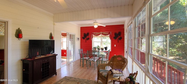 sunroom / solarium with wooden ceiling and ceiling fan