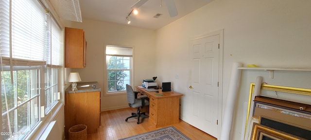 office featuring track lighting and light hardwood / wood-style flooring