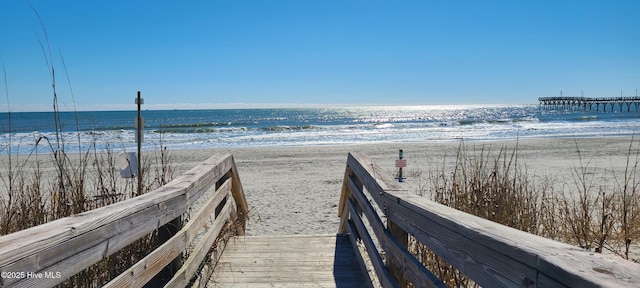 surrounding community featuring a water view