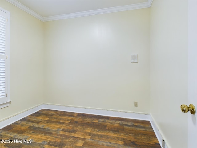 spare room with crown molding and dark hardwood / wood-style floors