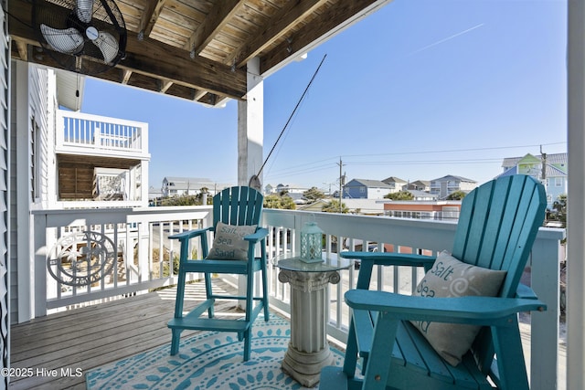 wooden terrace featuring ceiling fan