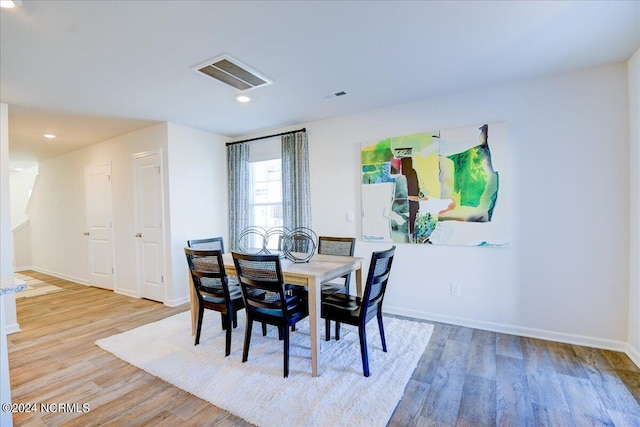 dining area featuring light wood-type flooring