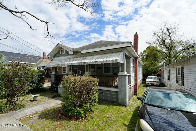 bungalow-style house featuring a front yard and a porch