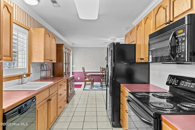 kitchen with sink, crown molding, black appliances, and light tile patterned floors