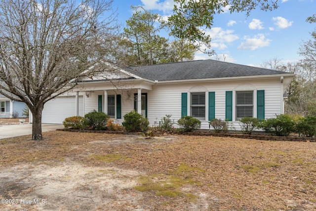 ranch-style home featuring a garage