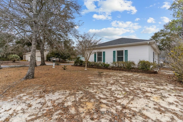 view of side of property with a garage