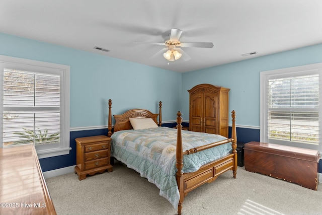 bedroom with light carpet and ceiling fan