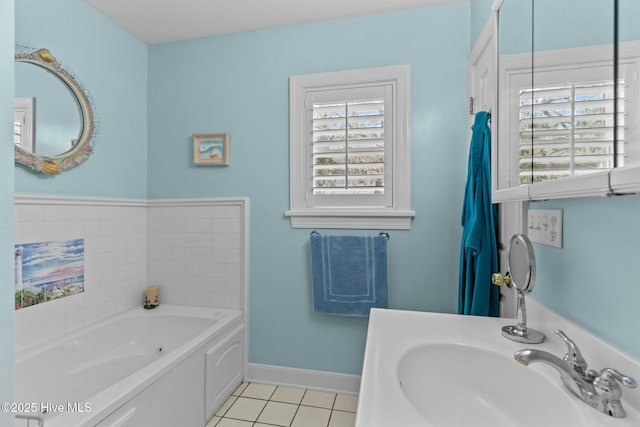 bathroom with sink, a bathtub, and tile patterned floors