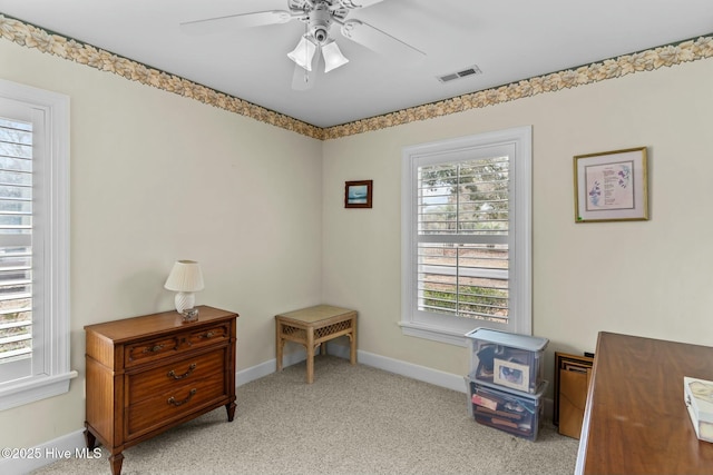 miscellaneous room featuring light carpet and ceiling fan