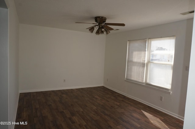 empty room featuring dark hardwood / wood-style floors and ceiling fan