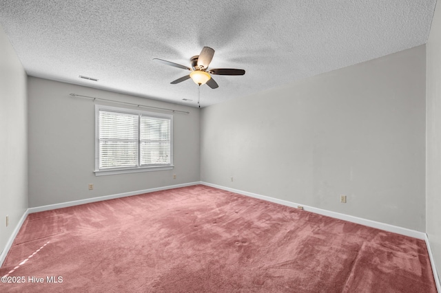 unfurnished room featuring carpet flooring, a textured ceiling, and ceiling fan