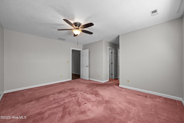 unfurnished bedroom with ceiling fan, a textured ceiling, and carpet flooring