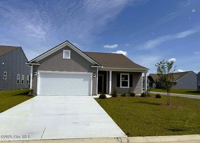 253 Hawks Run Dr Unit 4060, Carolina Shores, NC 28467 - view of front of property with concrete driveway, a garage, and a front lawn