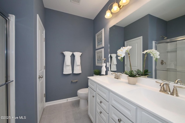 253 Hawks Run Dr Unit 4060, Carolina Shores, NC 28467 - bathroom with an enclosed shower, tile patterned floors, toilet, double vanity, and baseboards