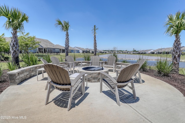 253 Hawks Run Dr Unit 4060, Carolina Shores, NC 28467 - view of patio / terrace featuring an outdoor fire pit, a water view, and a residential view