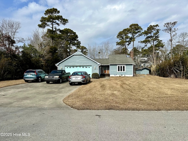 single story home featuring a garage and a front lawn