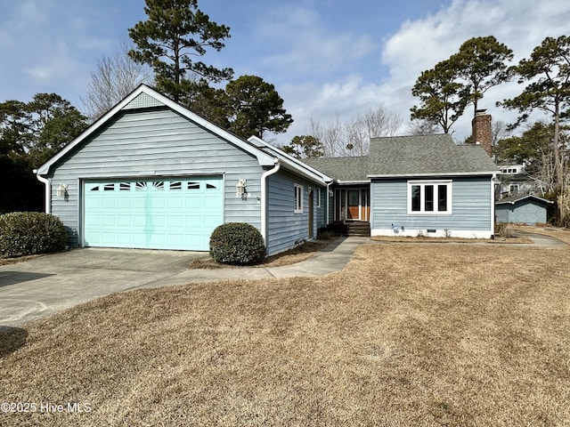 ranch-style house featuring a garage and a front yard