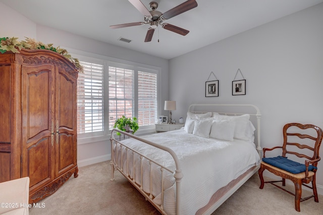 bedroom with light colored carpet and ceiling fan