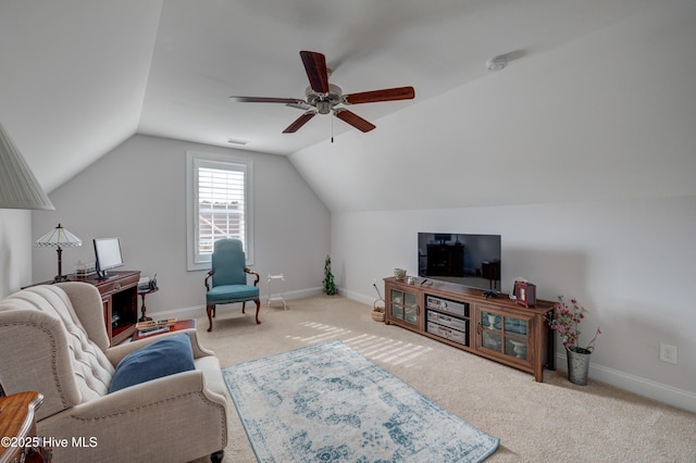 living room with ceiling fan, carpet flooring, and vaulted ceiling