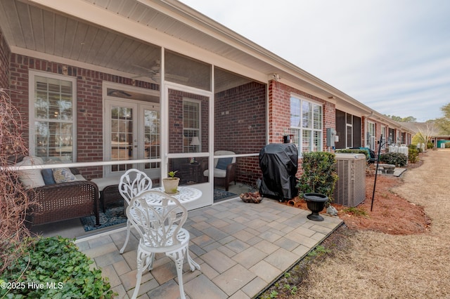 view of patio featuring cooling unit, grilling area, and french doors