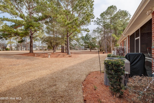 view of yard with central AC