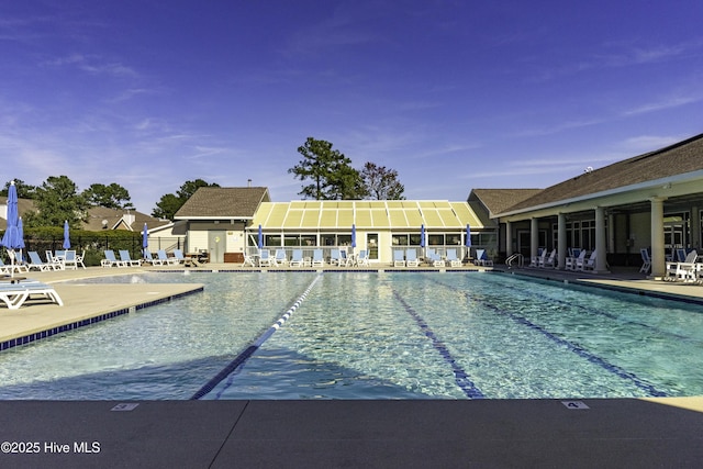 view of swimming pool with a patio area