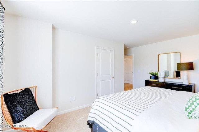 bedroom featuring light colored carpet