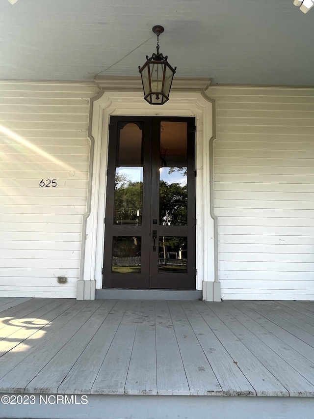 view of exterior entry featuring french doors