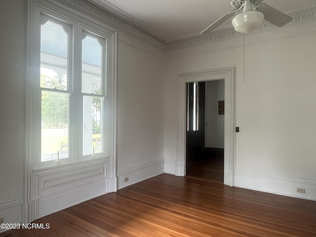 unfurnished room with wood-type flooring, ornamental molding, and ceiling fan