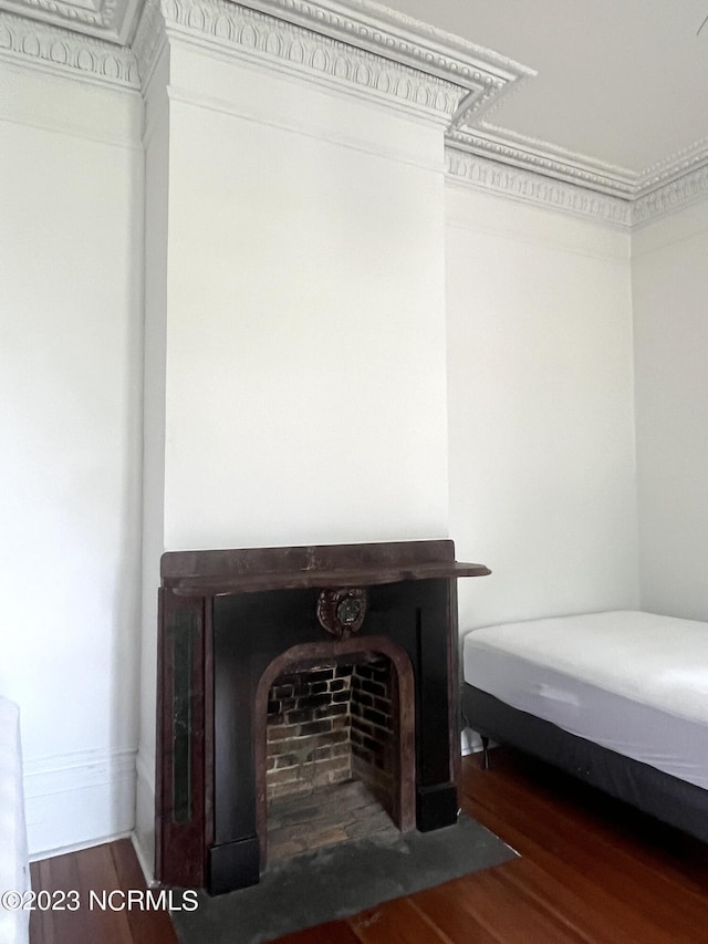 room details with hardwood / wood-style floors and ornamental molding