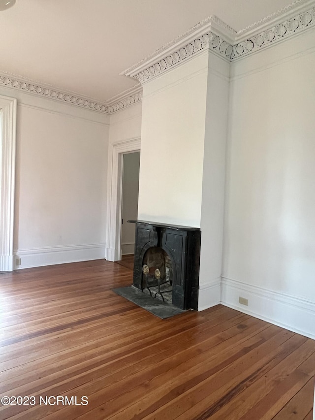 unfurnished living room with hardwood / wood-style floors