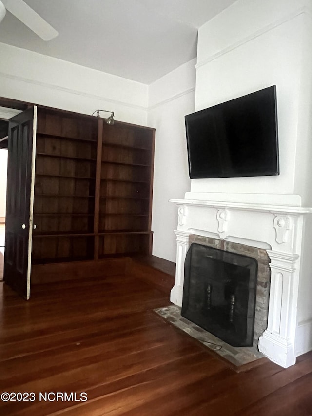 unfurnished living room featuring dark hardwood / wood-style flooring