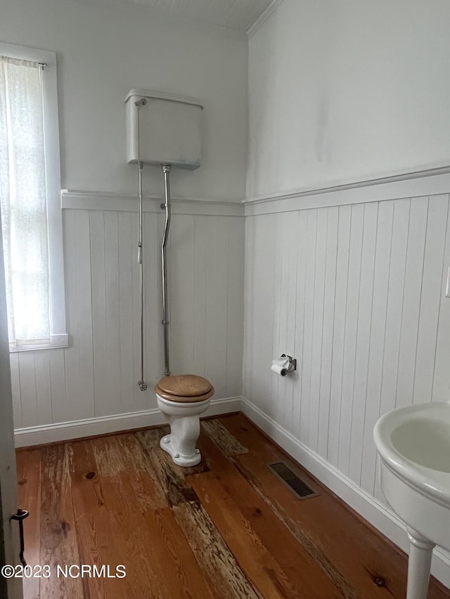 bathroom with sink, hardwood / wood-style flooring, and toilet