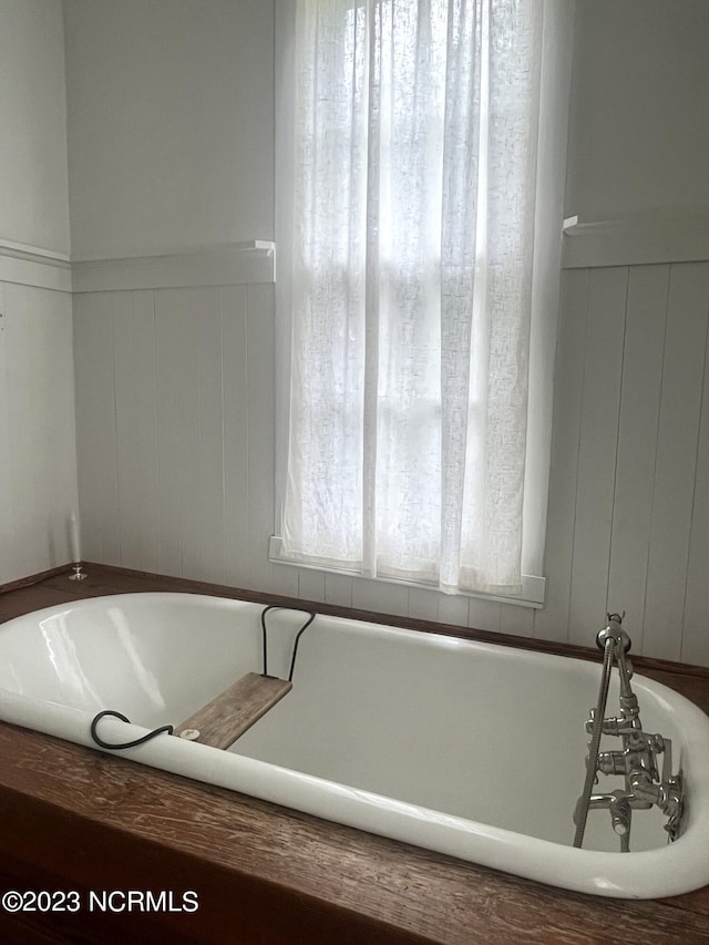 bathroom with a tub