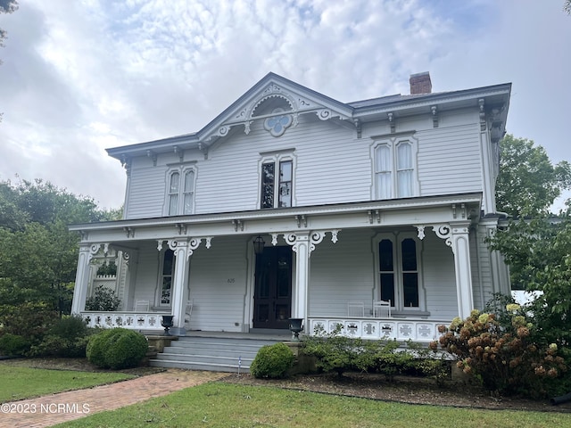 italianate house featuring covered porch