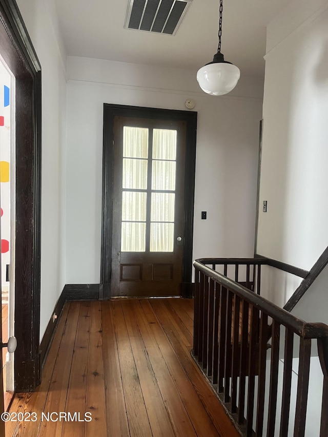 doorway featuring dark hardwood / wood-style floors