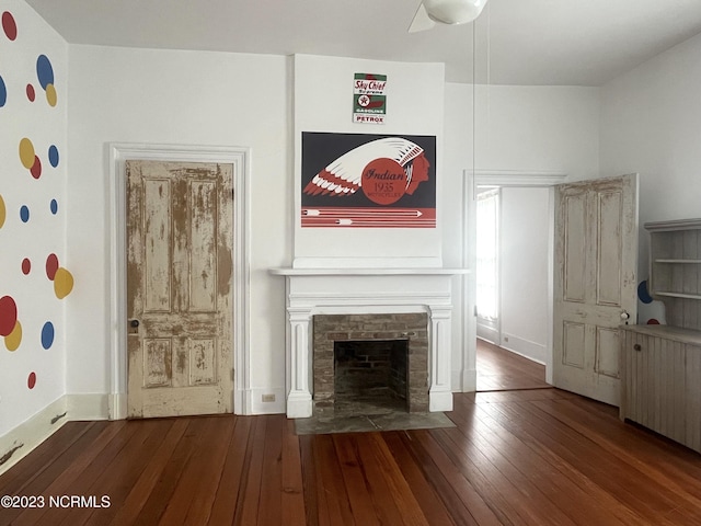 unfurnished living room featuring dark hardwood / wood-style flooring