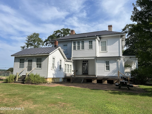 back of house with a yard