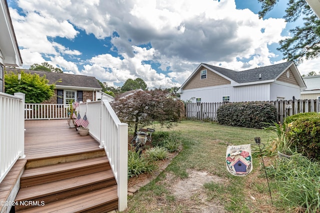 view of yard featuring a wooden deck