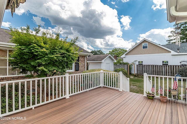 wooden deck with a shed