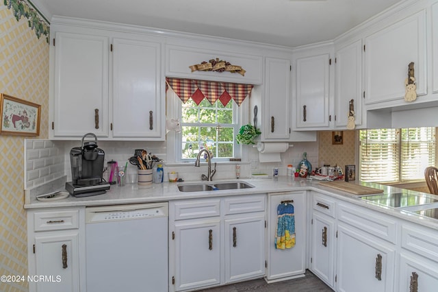 kitchen featuring backsplash, white dishwasher, sink, and white cabinets