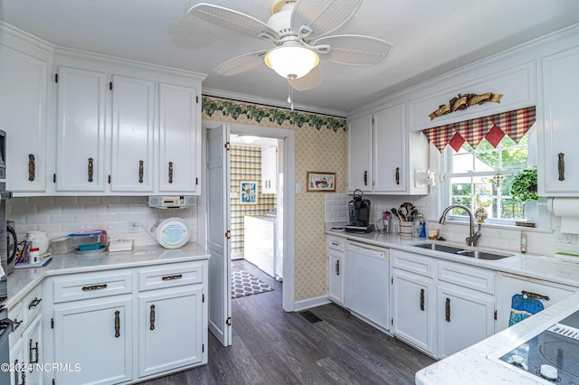 kitchen featuring dark hardwood / wood-style floors, sink, white cabinets, ceiling fan, and white dishwasher