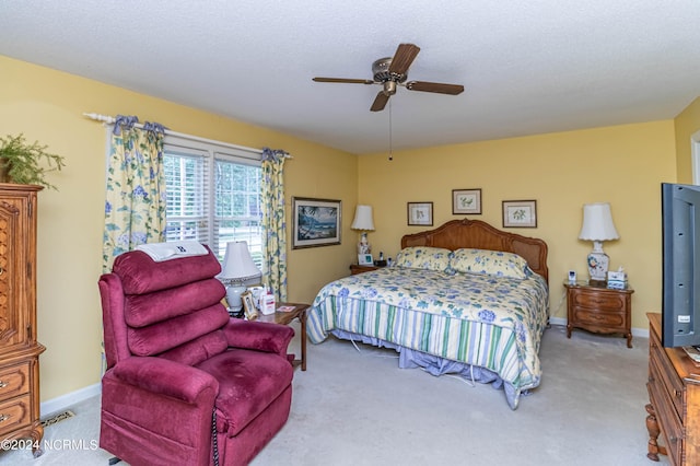 bedroom featuring ceiling fan and light colored carpet