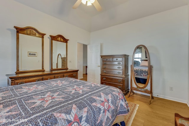 bedroom featuring ceiling fan and light hardwood / wood-style flooring