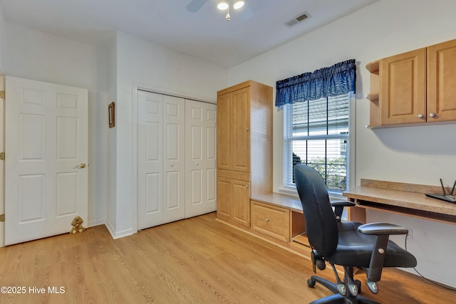 office with ceiling fan and light hardwood / wood-style floors